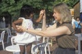 A Caucasian woman playing with an Indian child,