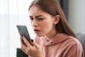 Woman with poor vision holding her smartphone