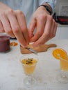 Caucasian woman preparing flutes glasses with fresh and homemade kombucha tea