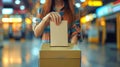 Caucasian woman putting a ballot into a voting box at a polling place. Female voter. Concept of democracy, elections Royalty Free Stock Photo