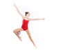 Caucasian woman rhythmic gymnast jumping with ball and looking away Royalty Free Stock Photo