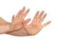 Caucasian woman`s hands. Wide spread fingers in stop gesture.