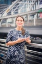 Caucasian woman shopping on phone and looking camera,Female positive emotions