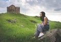 Caucasian Woman sits on the rock Royalty Free Stock Photo