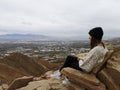 Caucasian woman sitting on a rocky chair enjoying the view from Living Room Trailhead hike Royalty Free Stock Photo