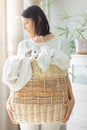 caucasian woman sorting dirty laundry basket, laundry at home Royalty Free Stock Photo