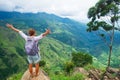 Caucasian woman standing and looking on mountain and valley.