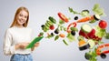 Caucasian woman with tablet using meal planning app, collage with flying vegetables, grey background. Copy space