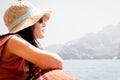 Caucasian woman tourist portrait relax lay on vacation on cruise ship deck enjoy sunny persian gulf panorama with rocky mountains