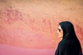 Caucasian woman tourist stand on Maharlu pink salt lake shore. Travel destination Iran in Shiraz