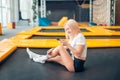 Caucasian women play with her smart phone in trampoline Royalty Free Stock Photo