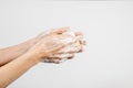 Caucasian woman washing her hands with bubbly soap bar isolated on white background Royalty Free Stock Photo