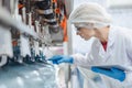 caucasian women worker working in water plant factory clean hygiene process in bottling drinking water machine line Royalty Free Stock Photo