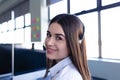 Caucasian woman working with headphone set Royalty Free Stock Photo