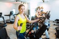 Caucasian woman and her friends doing step training in gym Royalty Free Stock Photo