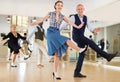 Woman and man dancing swing in studio