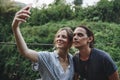 Caucasian woman and man taking a selfie outdoors recreational leisure, freedom and adventure concept