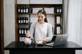 Caucasian Women are putting coins in a piggy bank for a business that grows for profit and saving money for the future. planning Royalty Free Stock Photo