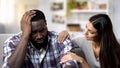 Caucasian woman supporting African-American boyfriend, life problems, stress Royalty Free Stock Photo