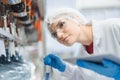 caucasian women worker working in water plant factory clean hygiene process in bottling drinking water machine line Royalty Free Stock Photo