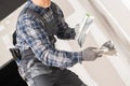 Caucasian Worker Patching Drywall Royalty Free Stock Photo