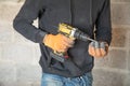 Caucasian worker using electric drill Royalty Free Stock Photo