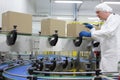 worker in white apron at packing line Royalty Free Stock Photo