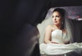 Caucasian young bride sitting in limo. Royalty Free Stock Photo