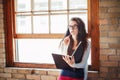 Caucasian young brunette woman student female drawing designer artist in hall of college university Royalty Free Stock Photo