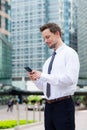 Caucasian young businessman read on the cellphone at hong kong