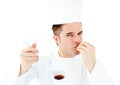 Caucasian young cook tasting a delicious soup Royalty Free Stock Photo