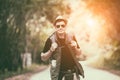 Caucasian young man backpacker travelling in local countryside Royalty Free Stock Photo