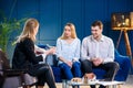 Caucasian young man and woman on the meeting with realtor, interior designer, decorator. Royalty Free Stock Photo