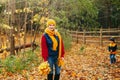 Caucasian young mother playing with cute adorable toddler boy son in autumn fall park outdoor Royalty Free Stock Photo