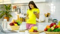 Caucasian young pregnant female mother in casual outfit with big belly tummy standing smiling holding vegetarian salad bowl eating Royalty Free Stock Photo