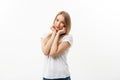 Caucasian young woman with cute adorable playful shy smile. Model white t-shirt isolated on white background Royalty Free Stock Photo