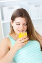 Caucasian young woman drinking orange juice Royalty Free Stock Photo