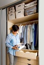 Caucasian young woman housewife holding container