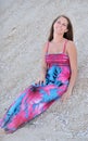 Caucasian young woman resting on sand dune Royalty Free Stock Photo