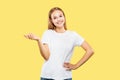 Caucasian young woman`s half-length portrait on yellow background Royalty Free Stock Photo