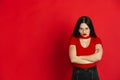 Caucasian young woman`s monochrome portrait on red studio background, emotional and expressive Royalty Free Stock Photo