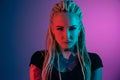 Caucasian young woman`s portrait on gradient background in neon light Royalty Free Stock Photo