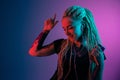 Caucasian young woman`s portrait on gradient background in neon light Royalty Free Stock Photo