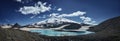 Caucasus Elbrus majestic mountain peak, blue sky lake, snow covered glacier, rocky landscape, alpine scenery Royalty Free Stock Photo