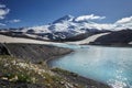 Caucasus Elbrus majestic mountain peak, blue sky lake, snow covered glacier, rocky landscape, alpine scenery Royalty Free Stock Photo