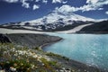 Caucasus Elbrus majestic mountain peak, blue sky lake, snow covered glacier, rocky landscape, alpine scenery Royalty Free Stock Photo