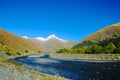 Caucasus mountains in summer, Peak Mkinvari and mountain river. view from village Sno