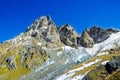 Caucasus Mountains, village Juta. green hill, blue sky, and snowy peak Chaukhebi in summer.