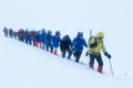 Caucasus / Russia - 07.15.2018 Group of climbers climbing mountain peaks.