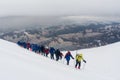 Caucasus / Russia - 07.15.2018 Group of climbers climbing mountain peaks.